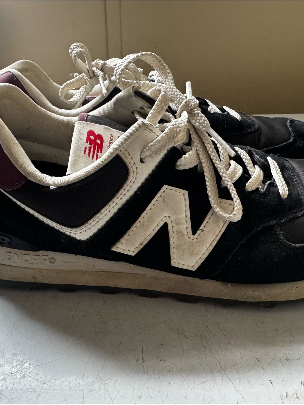 New Balance Black & White Sneakers with Red Tongue Logo